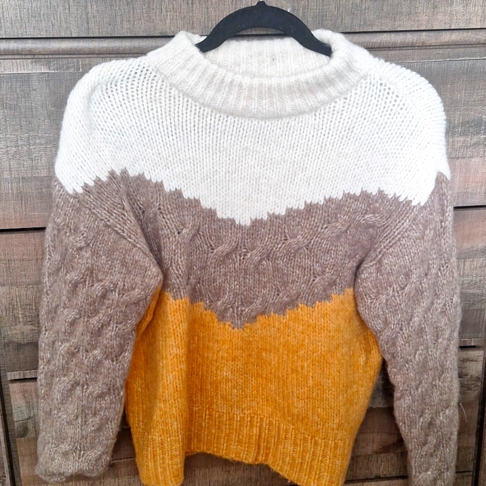 Comfy sweater. Acrylic/nylon but soft & fuzzy. Never worn.